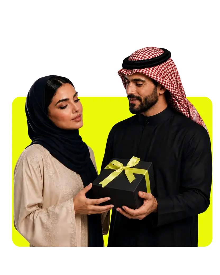 Alkhaleej Scents gift packaging with an elegant black gift box and lime green ribbon shared by a couple.